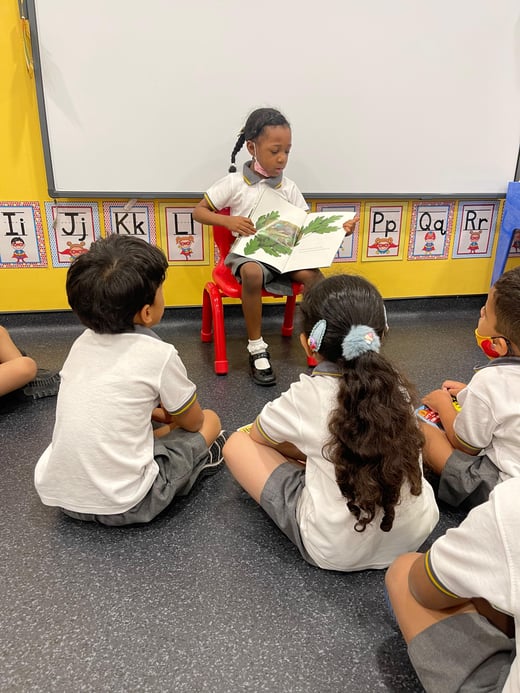 American School Dubai Kindergaten Reading to classmates